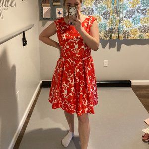 Red and White Floral, knee-length dress with red snap belt.